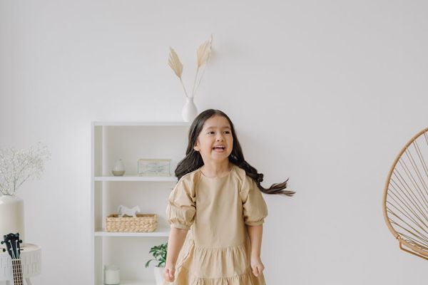 Person stretching in a calm, minimalist room with natural light.